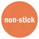 Orangefarbener Kreis mit weißem Schriftzug „non-stick“ als Symbol für antihaftende Eigenschaft.