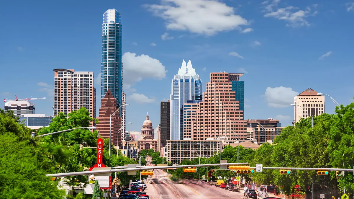 Austin, Texas skyline with skyscrapers, Congress Avenue, and the Texas State Capitol in downtown Austin.