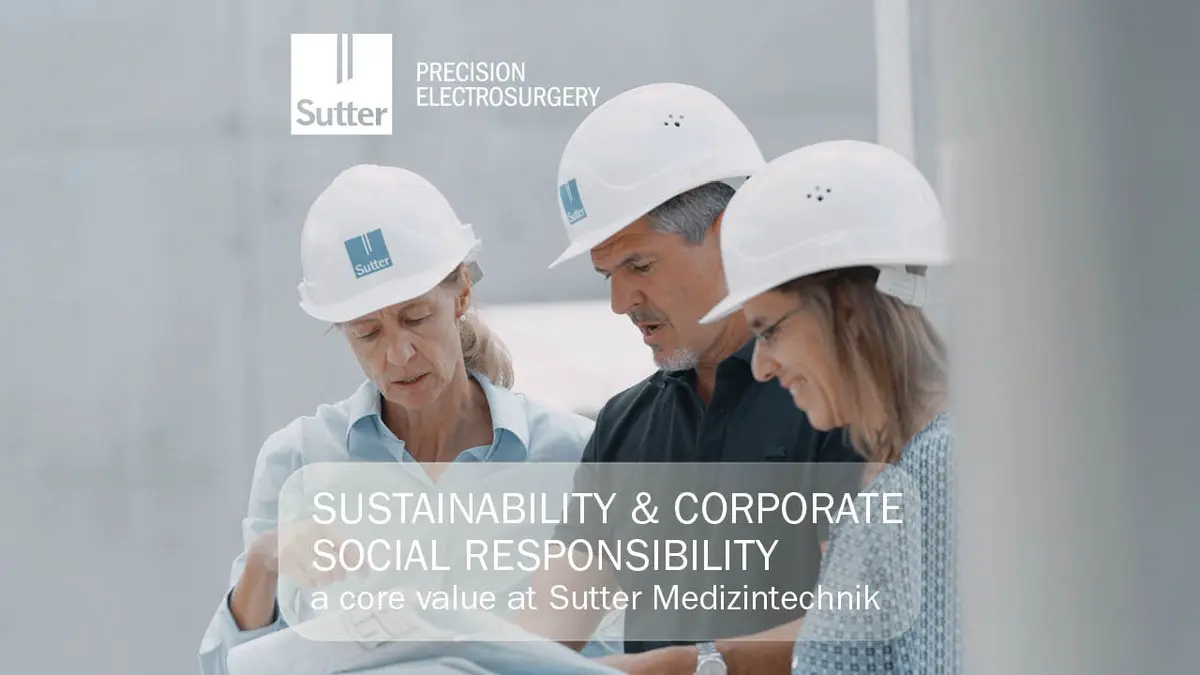 Three people with Sutter hard hats reviewing construction plans, symbolizing sustainability and corporate social responsibility at Sutter Medizintechnik